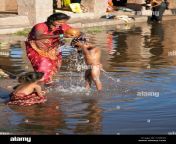 mother washing her son tungabhadra river hampi india ct963d.jpg from nude indian family bath river kumbhamela