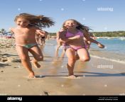 blonde young caucasian girls 8 10 years old running on the shore plage bayagw.jpg from 810girl