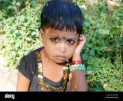 a sadly crying small indian village child girl looking on lens bhwb2k.jpg from village painful cryin