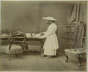 indian servant arranging tea pots circa 1869.jpg from indian village servant a