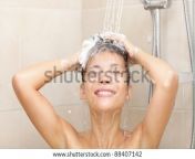 stock photo woman in shower washing hair with shampoo beautiful woman showering washing long hair with 88407142.jpg from www বাংলা নতুনx ভিডিও ডাউনলোড village woman long hair washgla video