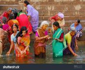 stock photo colorful hindu women bathing in the ganges in varanasi 10141579.jpg from kumbh mela bathing hot sexy