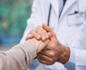 male doctor holding female patients hands.jpg from doctor n patient