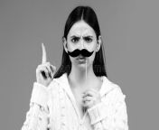 woman fake mustache having fun funny female actress finger up isolated blue background woman fake mustache 309114793.jpg from fakes for fun actress