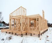 wood frame house under construction bare pile foundation winter season walls 240391016.jpg from russianbare 15