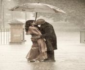 indian couple kissing under umbrella rain ki smartly dressed holding 76149318.jpg from indian lover kissing outdoor