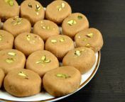 indian traditional sweet pedha peda peday made milk khoya some other ingredient like cardamom seeds pistachio nuts 128491908.jpg from pedda