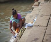 indian woman sari washing clothes river 23237821.jpg from indian aunty washing her a