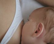 mother lying bed to feed breast milk to her newborn baby closeup baby sucking eating its mother milk concept 183168079.jpg from বাংলা নায়িকা লোপা হট mother baby eat milk sex video