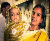 mother son rajasthan bikaner circa december native woman yellow dress bindi forehead poses her arms 84888280.jpg from www dise mother son indian