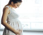 pregnancy motherhood people expectation concept close up happy pregnant woman big belly looking to window pregnancy 110311369.jpg from a pregnant resting while standing on a paved parking area in custer state park south dakota with a bright green prairie in the background trbyxb jpg