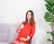 asian pregnant woman smile sitting sofa hold glass milk asian pregnant woman smile sitting sofa hold 172984671.jpg from sex preagnant milk asian tits drink black