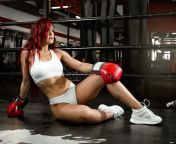 beautiful attractive sexy girl red hair boxing ring sits gym 211400129.jpg from sexy gal and harsh