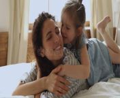 cute little kid daughter embrace kiss mom lying bed affectionate family cute adorable funny little kid daughter embrace kiss 161555532.jpg from funny cute mom kiss