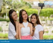 three happy young asian women as friends taking selfie phone selfie stick together nature outdoors portrait three 191196022.jpg from young asians playing flashing and masturbating on camera