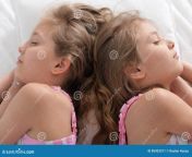 two sisters twins sleeping their bad 85423311.jpg from skinny sister sleeping