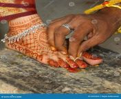 wedding ceremony male groom holding foot ring hindu indian 34434364.jpg from indian foot reing sax