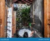 young woman having bath beautiful villa located remote village ubud bali indonesia stone bathup outdoor 51500076.jpg from young village bathroom in showing nude videos