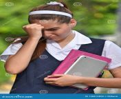 young pretty colombian teenage girl sad student teenager school girl wearing school uniform 138815858.jpg from más school student girl www xvidios com