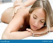 young blond women having massage spa salon massage body care body massage treatment young blonde woman having massage 100444819.jpg from japanese body massage videoéèæµå§