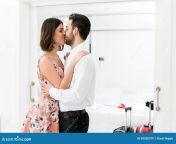 young couple kissing hotel suite close up portrait romantic kiss 69350799.jpg from kissing hotel sex