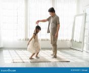 happy asian father daughter dancing waltz home smiling korea japanese dad spending time his cute little weekend 281467891.jpg from japanese dad and daughter home