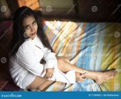 lifestyle indian girl home quarantine top view young bengali brunette woman white long shirt sitting her bed studio 171084862.jpg from pretty indian babe home