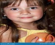 little year old girl closeup cute happy yellow big dark eyes long dark hair earrings holding balloon shallow 56413029.jpg from little 5y o