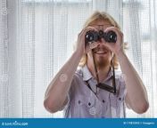 man binoculars spying neighbors young adult his guy using looking window 179875942.jpg from spying