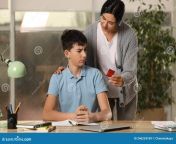 mother giving condom to her teenage son doing homework home sex concept mother giving condom to her teenage son 246224769.jpg from mom and son condom vedio