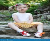 portrait cute little girl background nature s sitting rocks vertically framed shot 170073760.jpg from pix ru