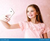 portrait cute smiling little girl child taking selfie isolated over pink background portrait cute little girl taking 133561097.jpg from little selfie