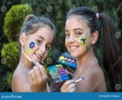 playful children painted face young girls 33256949.jpg from vintage young naturist family contest