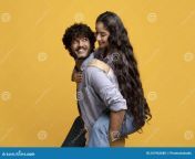 pretty indian lady piggybacking her boyfriend smiling guy carrying his girlfriend back yellow background millennial having fun 241962680.jpg from cute indian with her bf full lage show