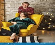 pregnant wife sits soft armchair husband stands nearby happiness parenthood husband pregnant wife 113343213.jpg from دوبی رقصxx videos asia wife pregnant 3gp