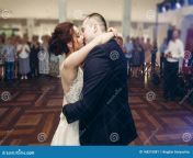 romantic newlywed couple kissing first dance wedding reception handsome groom hugging sensual bride wedding moment 168210881.jpg from newly wed couple kissing