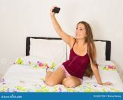 selfie home young woman taking her phone her bedroom 60551326.jpg from horby making her selfir for her bf