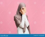 shy arabic woman hijab peeking fingers interest modesty concept shy muslim girl hijab peeking fingers 169911417.jpg from shy arab