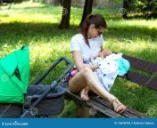 stylish young mom parent nursing beautiful baby surrounded green grass public park lady breastfeeding infant 126640468.jpg from breastfeeding park
