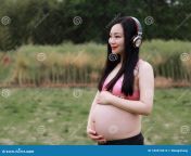asian chinese pregnant woman yoga dress do exercise workout nature stand grass lawn meditation live balanced life go 182674616.jpg from pregnant china rap jo sex xxx