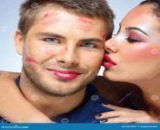 attractive woman kissing happy man women men over blue background 45816651.jpg from lipstick kisses over face