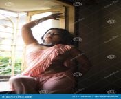 fashion portrait young attractive indian brunette woman traditional wear sari standing front window indoor 171084800.jpg from indian boudi show her big boob selfie video