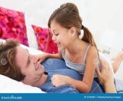 father daughter lying bed together smiling 31342881.jpg from daddy sex sleeping
