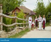 full length image family kids traditional romanian clothes countryside walking outside together happy father mother 249092782.jpg from village full length