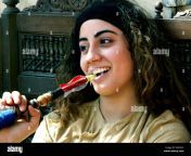 young egyptian girl smoking a hookah water pipe in the khan el khalili ggxykc.jpg from egyptian smoking