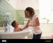 mother and son having fun at bath time together hm7tp2.jpg from mother and son in bath tub