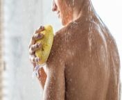 young man washing his body with sponge t8mjrxy.jpg from morning shower