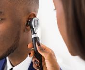 audiologist checking persons hearing with otoscope jpeg from photos hearing