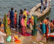 hindu women bathing in the ganges river in varanasi india 11350940336.jpg from ganga lady snan holi river bath cute
