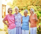 four older women standing outside of a retirement community.jpg from senior